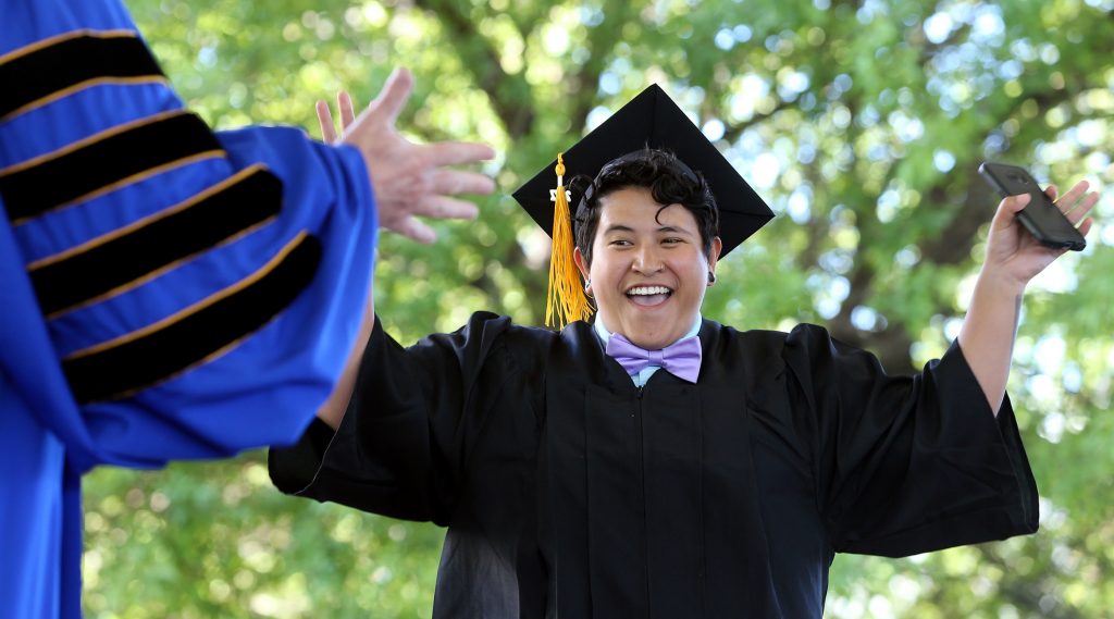 Isabel Meza, of Gardnerville, celebrates as she receives her diploma at the Western Nevada College 2017 Commencement in Carson City, Nev.